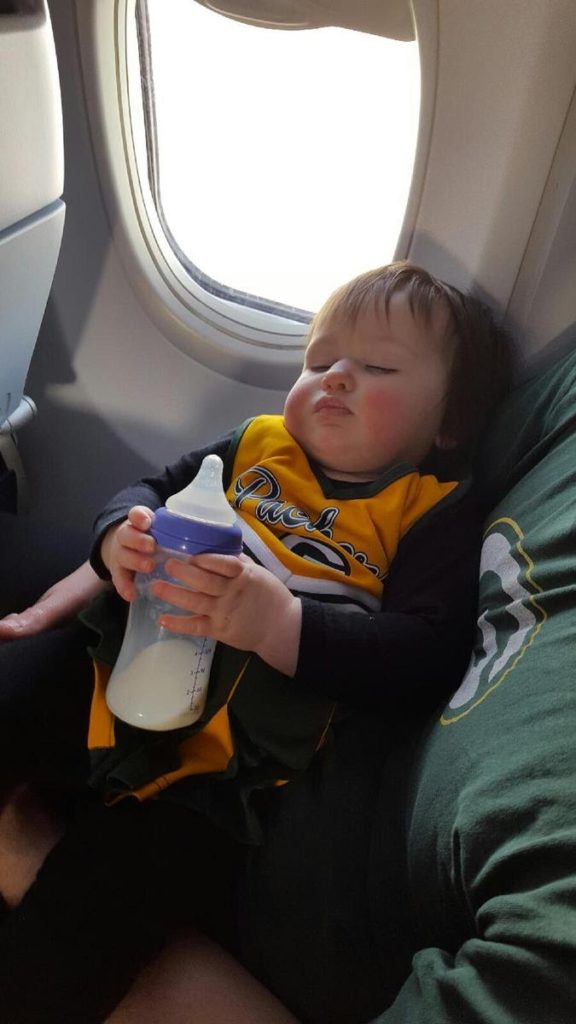 child napping on the plane